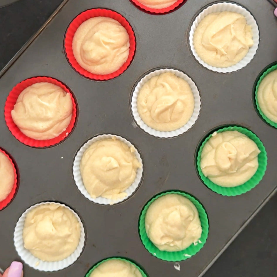 Baking tray with cupcake liners and batter